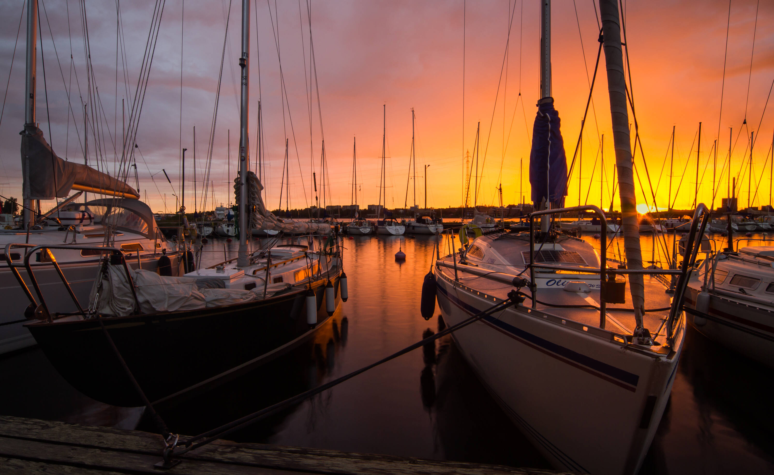 Sailing boats in harbour at sunrise in Vaasa, Finland.