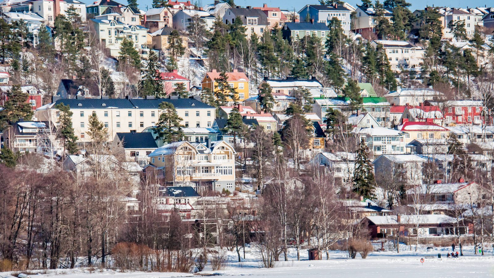 Wintery view of houses on a in Pispala, Finland.
