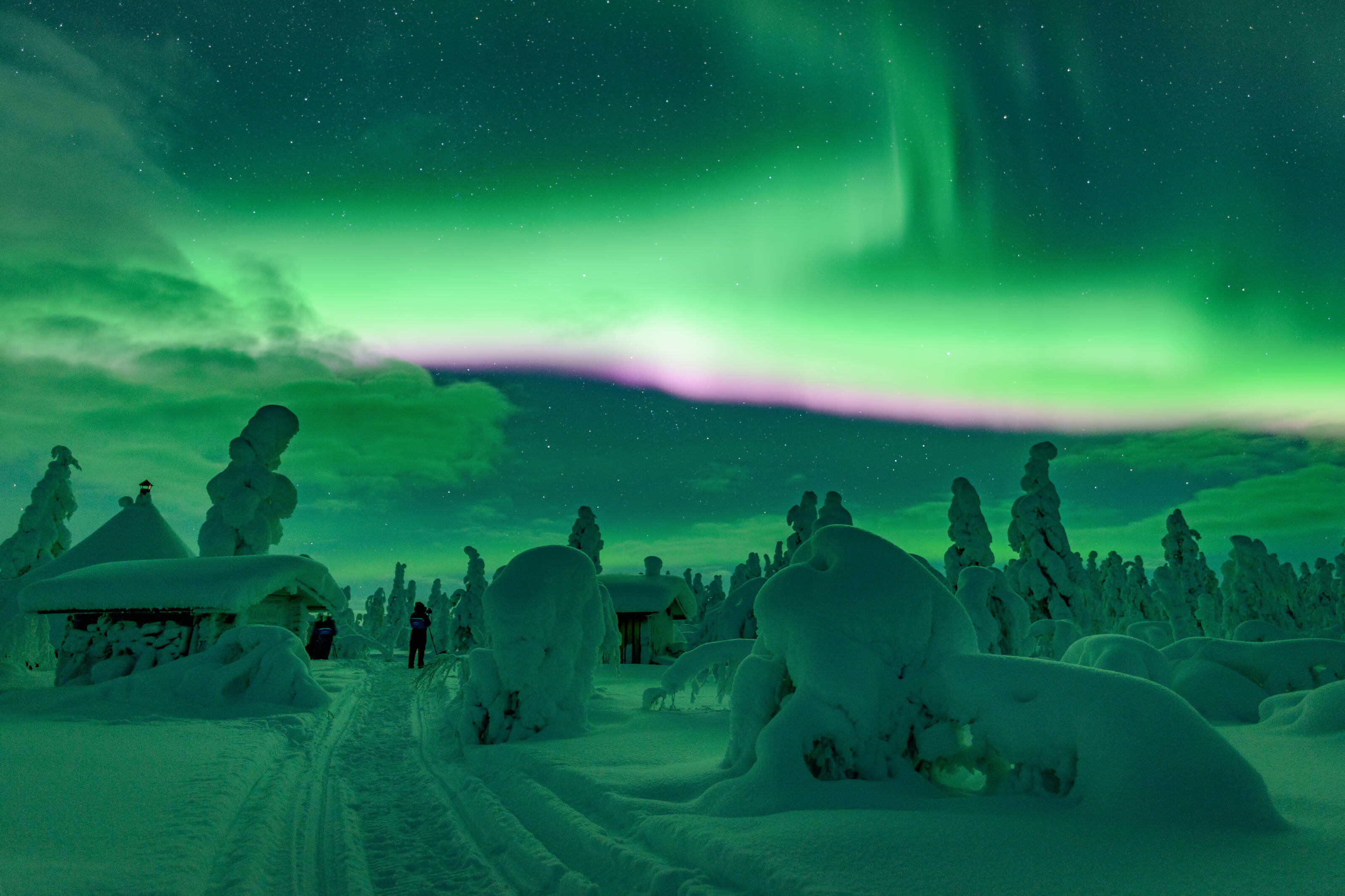 Northern lights and a green sky in Lapland, Finland during winter