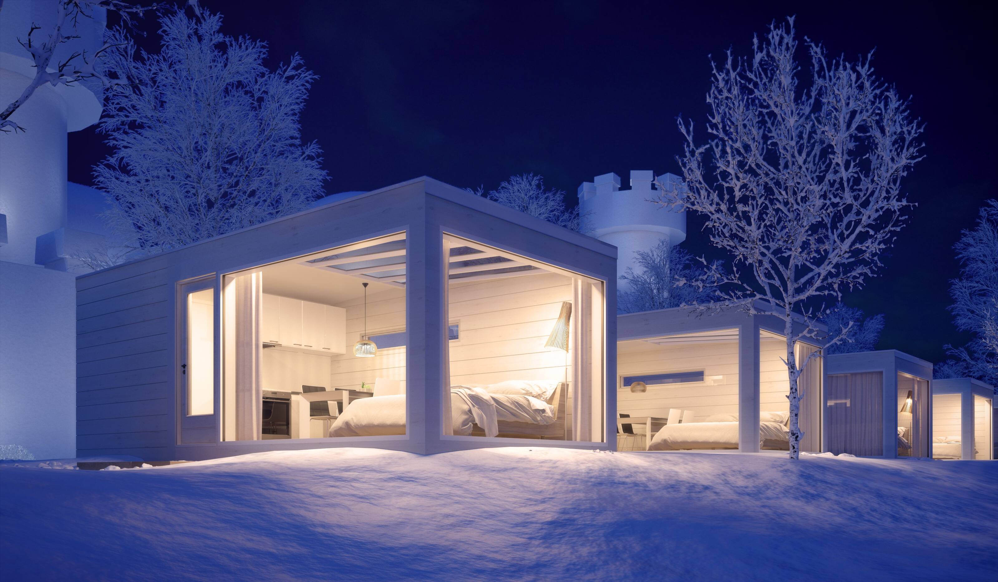 Glass villas in a snow-covered surrounding in Sea Lapland.