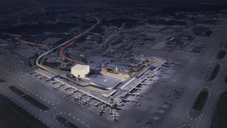 An aerial view of Helsinki airport at night.