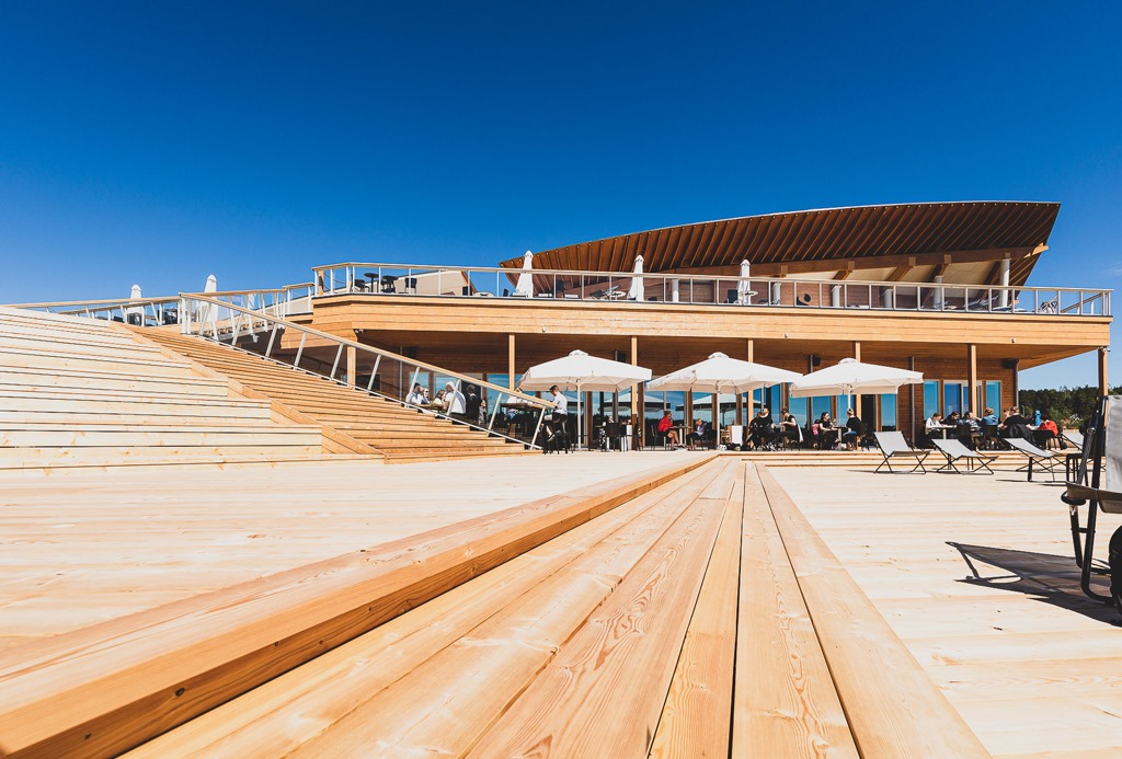 The wooden terrace of a public design sauna complex.