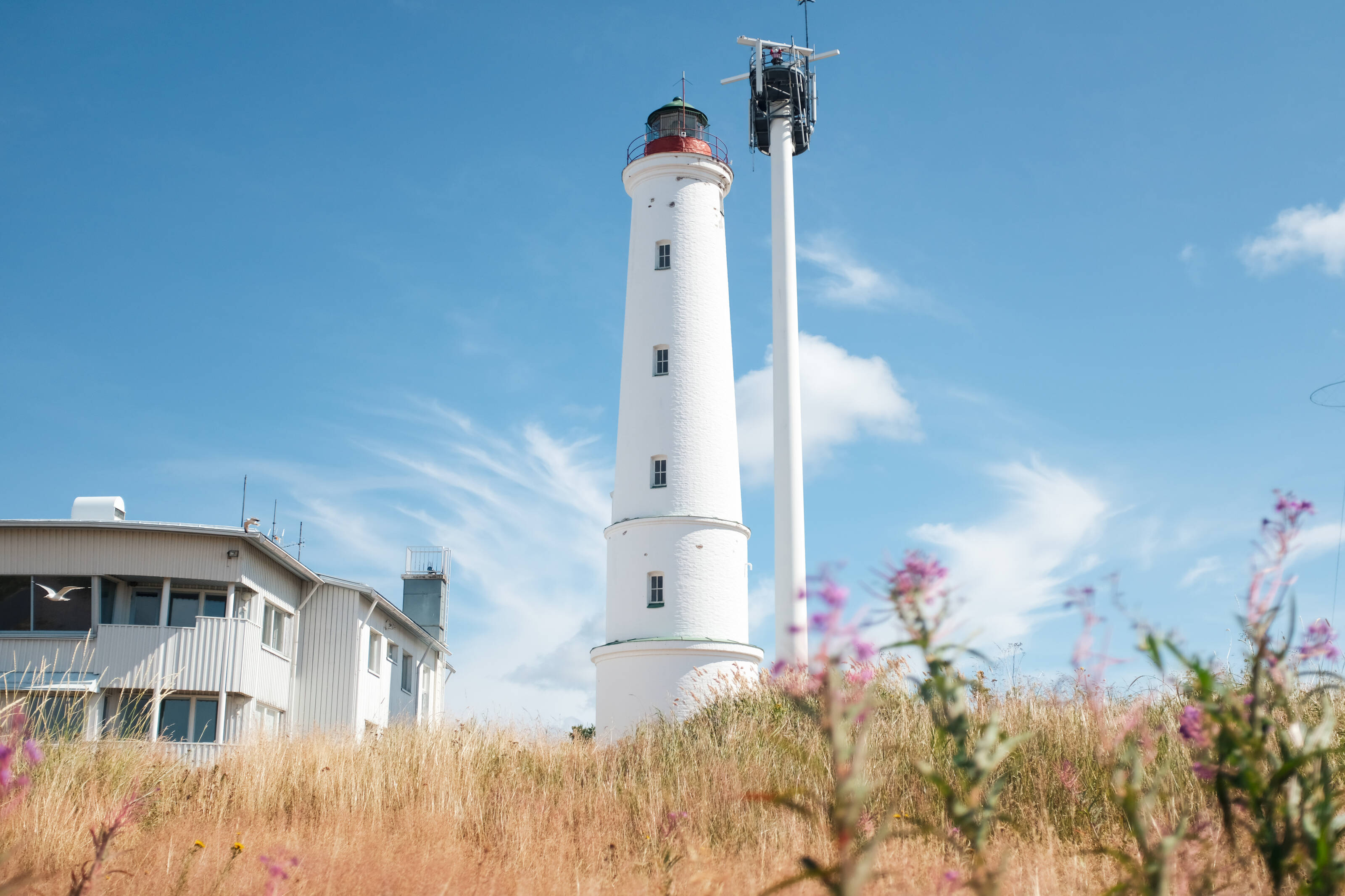 View of a white lighthouse in the archipelago on a summer day in Oulu, Finland